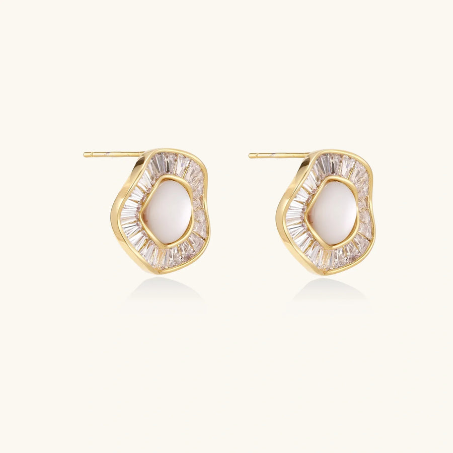 Gold-plated stud earrings with central freshwater pearl surrounded by radiating baguette crystals in sunburst design