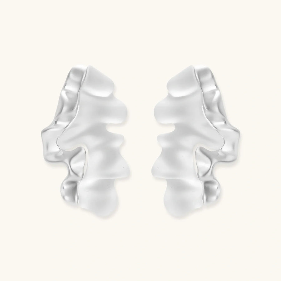 Modern sculptural jewelry set with flowing ribbon-like earrings and matching pendant in eco-zinc alloy finish