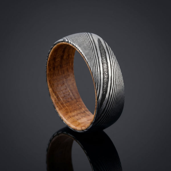 Hephaestus men's Damascus steel ring – angled view