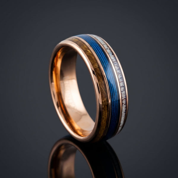Valknut men's rose gold tungsten ring with whiskey barrel oak, deer antler and fishing line inlay – angled view