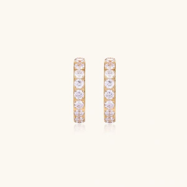 Gold pavé hoop earrings with two freshwater pearls nestled inside the curved design, featuring crystal-studded outer edge.