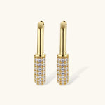 Gold-plated huggie hoop earrings with pavé zirconia stones covering the bottom curve, shown in open and closed positions.