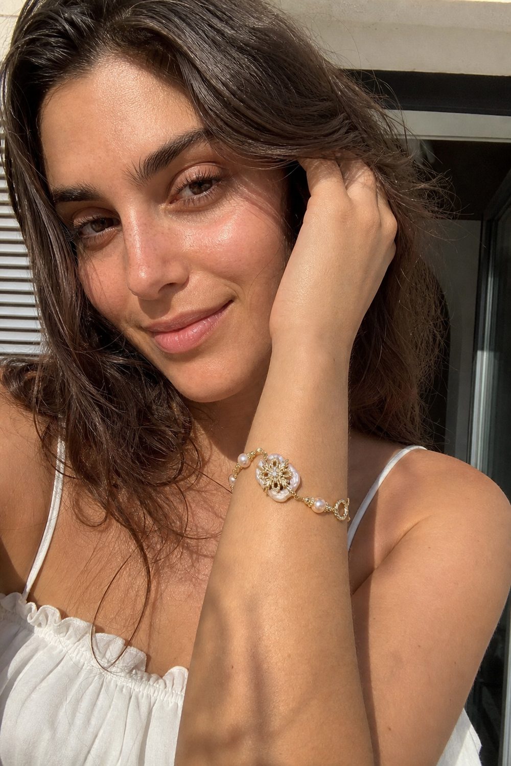 Customer wearing Baroque Pearl Bloom Bracelet